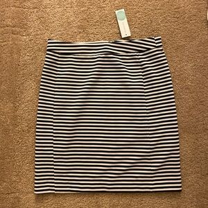 Knee-length black and white skirt.
